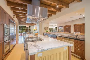 18595 Lomita Avenue Sonoma Kitchen with marble top built in range and overhead hooded vent